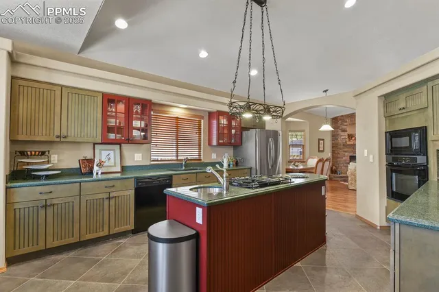 a kitchen with a sink and stove