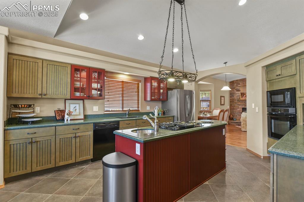 2563 Integrity Court Colorado Springs, CO 80918 - Photo 10 of 49 a kitchen with a sink and stove