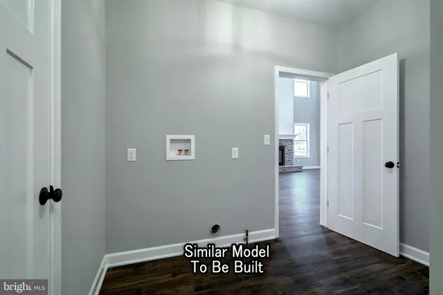 a bathroom with a sink and mirror with window