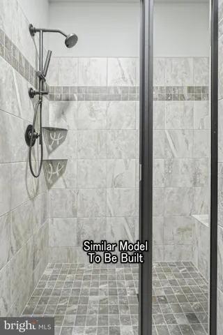 a kitchen with kitchen island granite countertop a stove a sink a refrigerator wooden floor and cabinets