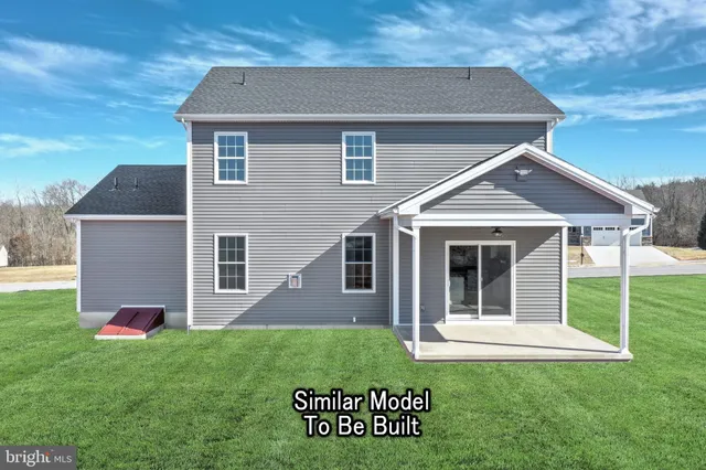 a close view of a sink a counter and appliances in a kitchen