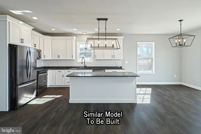 a view of an empty room with window and ceiling fan