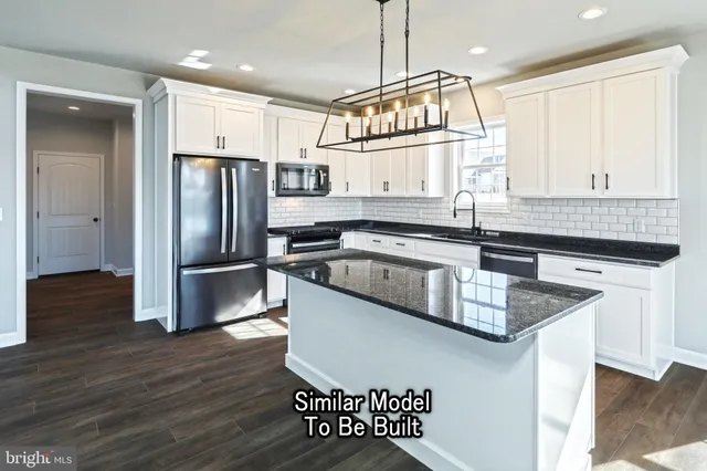 an empty room with windows and ceiling fan