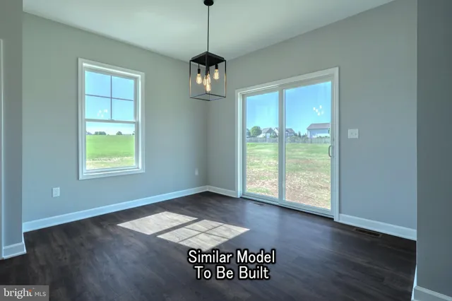 a kitchen with kitchen island granite countertop a stove a sink a refrigerator and a microwave