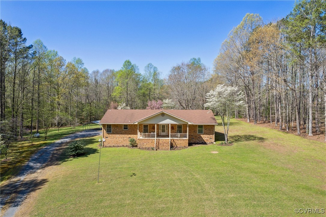 17033 Wilkinson Road Dinwiddie, VA 23841 - Photo 1 of 1 View of front of home featuring covered porch, a f