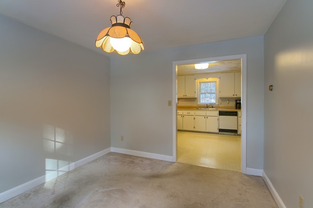 215 South Road Pepperell, MA 01463 - Photo 8 of 11 a view of a kitchen cabinets and a chandelier