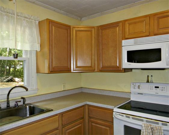 225 Island Road Lunenburg, MA 01462 - Photo 8 of 30 a kitchen with a sink and cabinets
