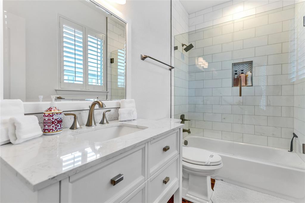 5744 Robbie Road Plano, TX 75024 - Photo 24 of 32 Bathroom featuring a white vanity with a rectangular undermount sink and a light-toned countertop