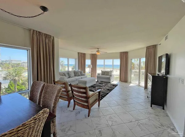 a lobby with furniture and floor to ceiling window