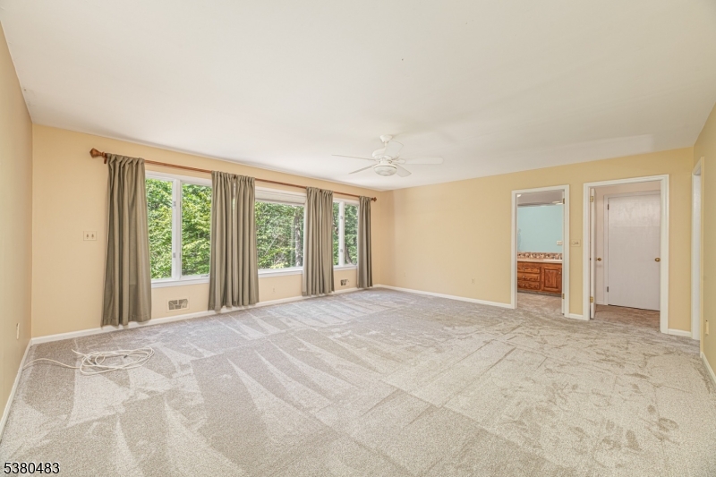 11 Indian Hollow Road Mendham, NJ 07945 - Photo 11 of 26 a view of an empty room with a window