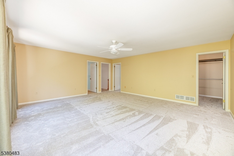 11 Indian Hollow Road Mendham, NJ 07945 - Photo 13 of 26 a view of an empty room with a window