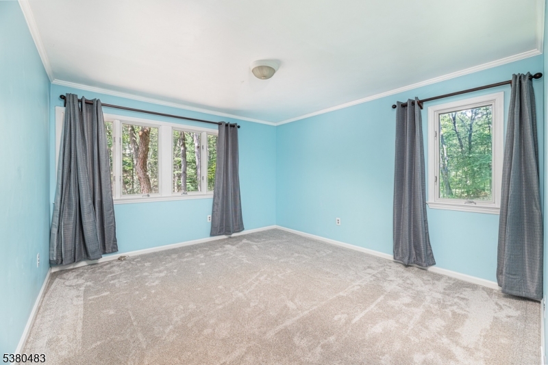 11 Indian Hollow Road Mendham, NJ 07945 - Photo 18 of 26 a view of a big room with windows and closet
