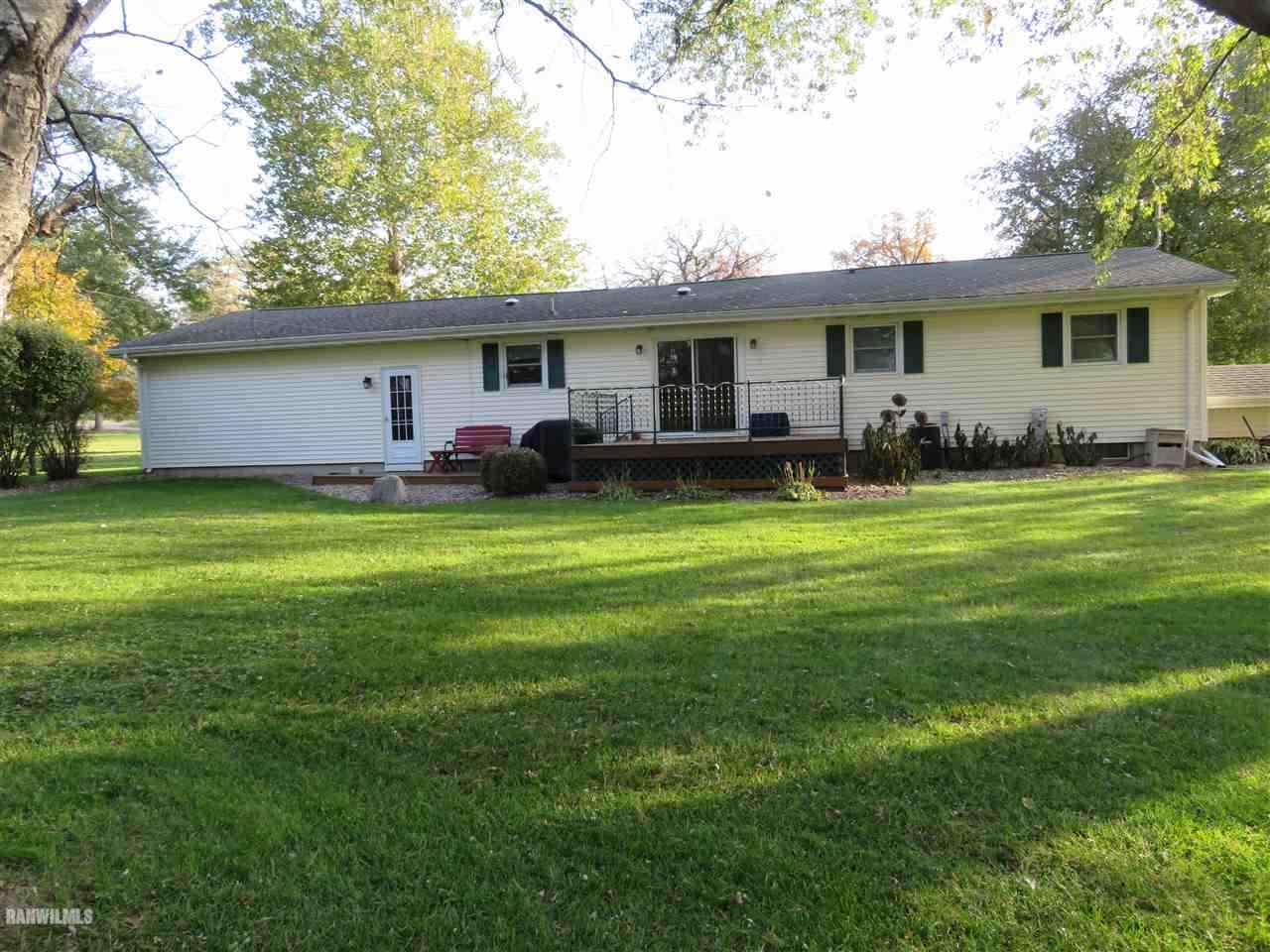 542 West Fairview Road Freeport, IL 61032 - Photo 3 of 5 a view of a house with a yard and trees