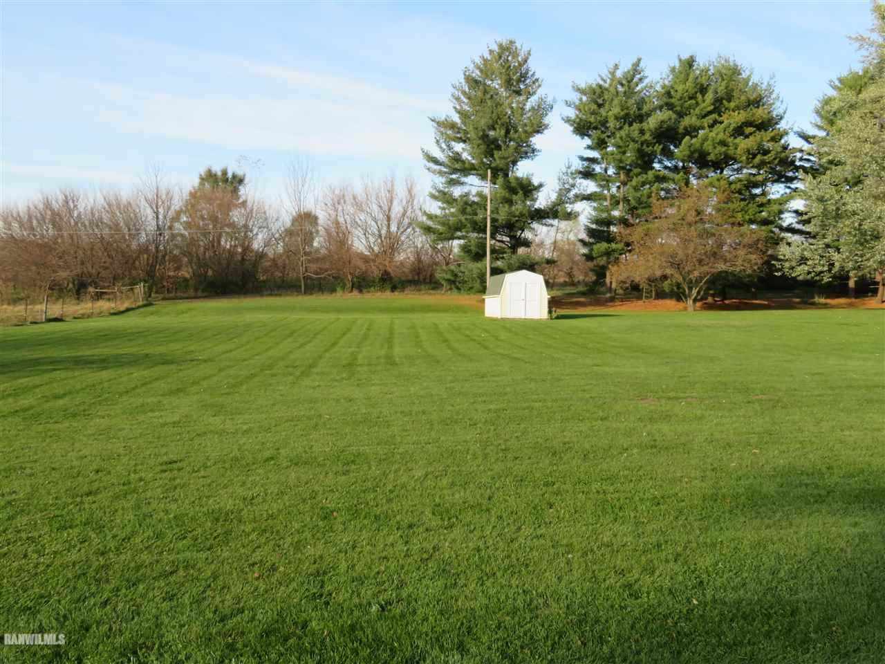 542 West Fairview Road Freeport, IL 61032 - Photo 5 of 5 a view of a big yard with large trees