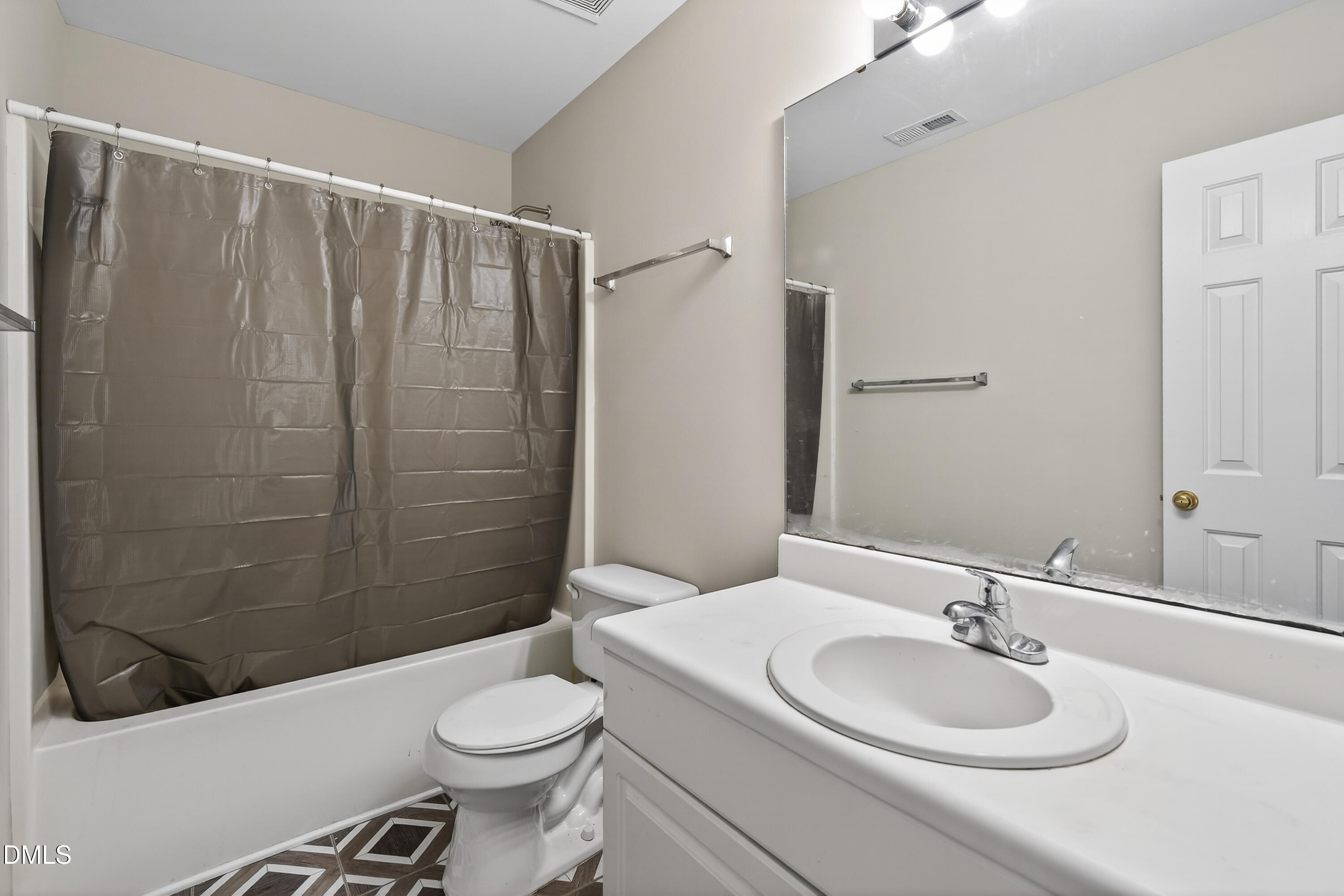 1601 Briarmont Court Raleigh, NC 27610 - Photo 27 of 30 a bathroom with a sink toilet and shower