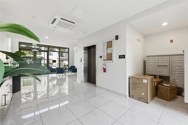 a kitchen with stainless steel appliances kitchen island granite countertop a refrigerator and a stove