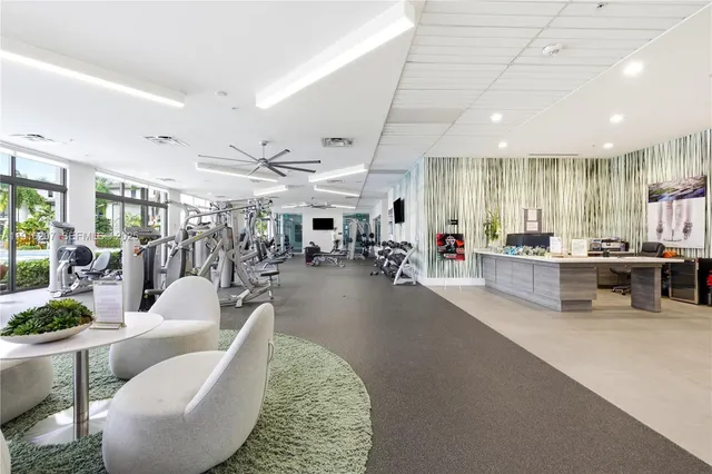 a living room with lots of furniture and white walls