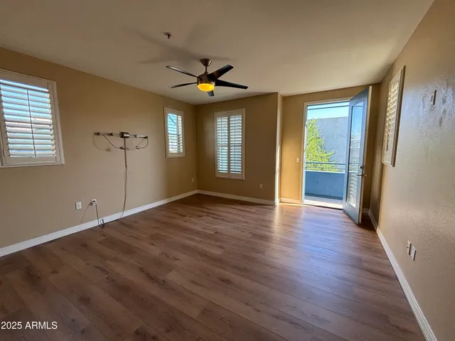 a view of a room with wooden floor and staircase