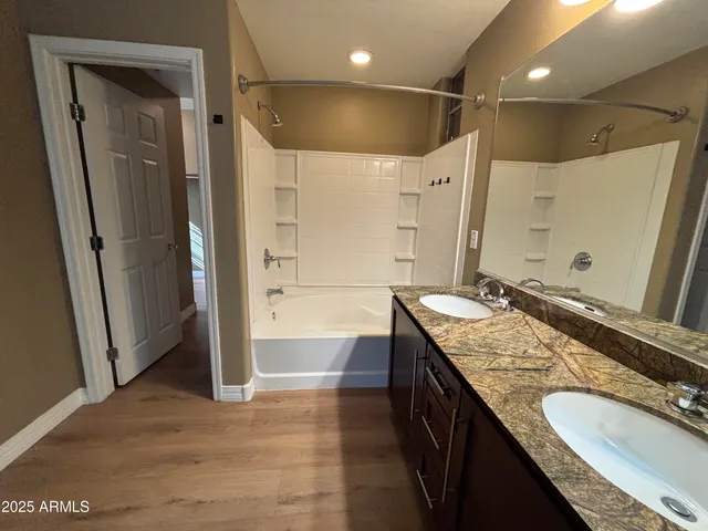 a bathroom with a sink vanity and a mirror