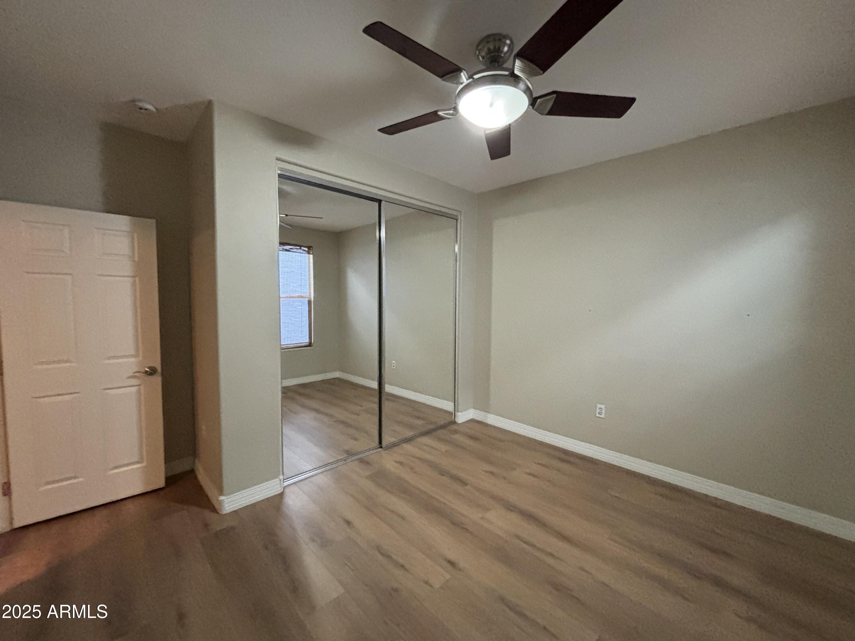 615 East Portland Street, Unit 113 Phoenix, AZ 85004 - Photo 19 of 28 an empty room with fan and entrance