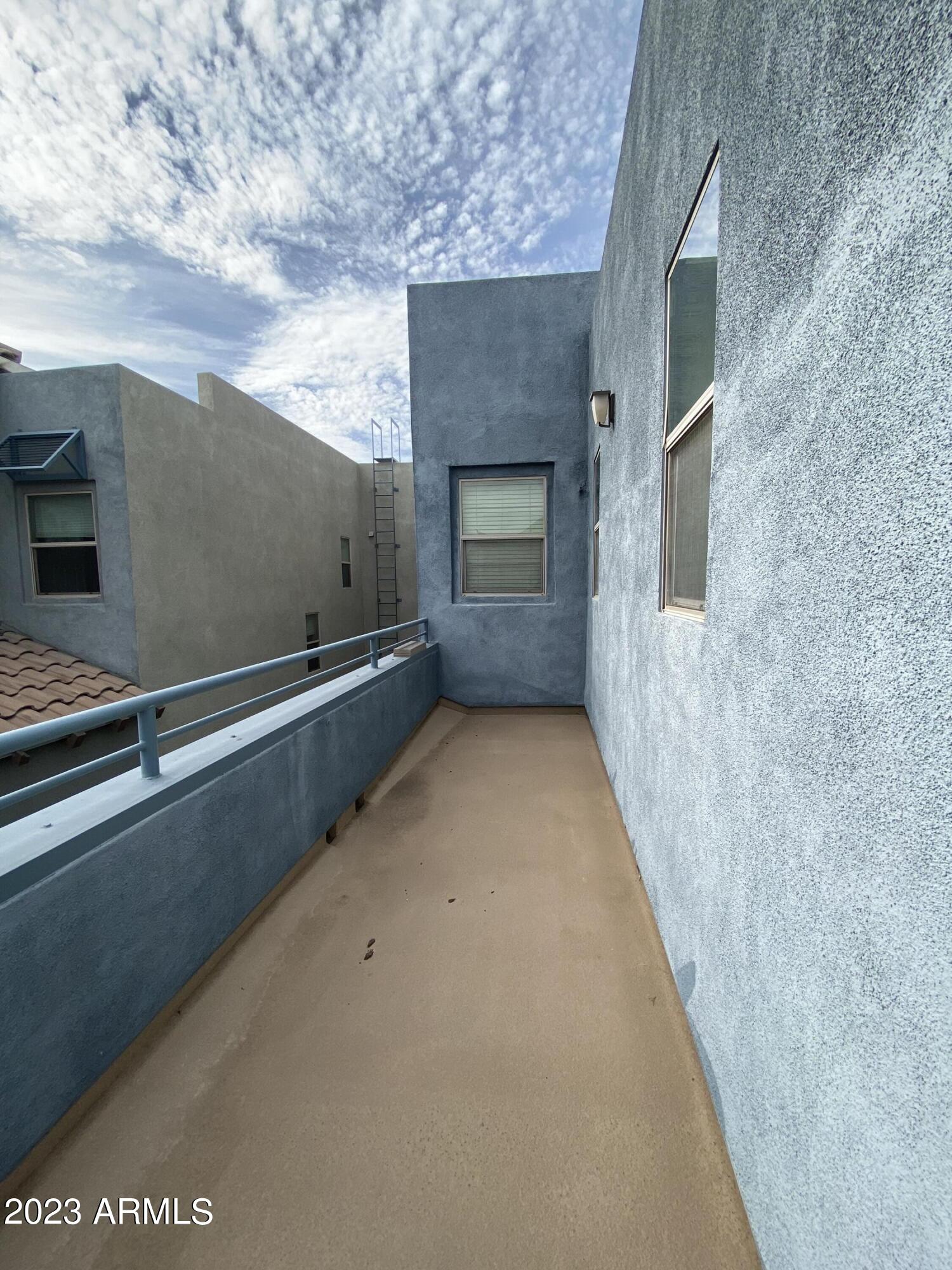 615 East Portland Street, Unit 113 Phoenix, AZ 85004 - Photo 22 of 28 a view of an empty room with a fireplace