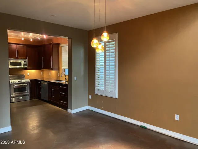 a view of kitchen and dining room with furniture
