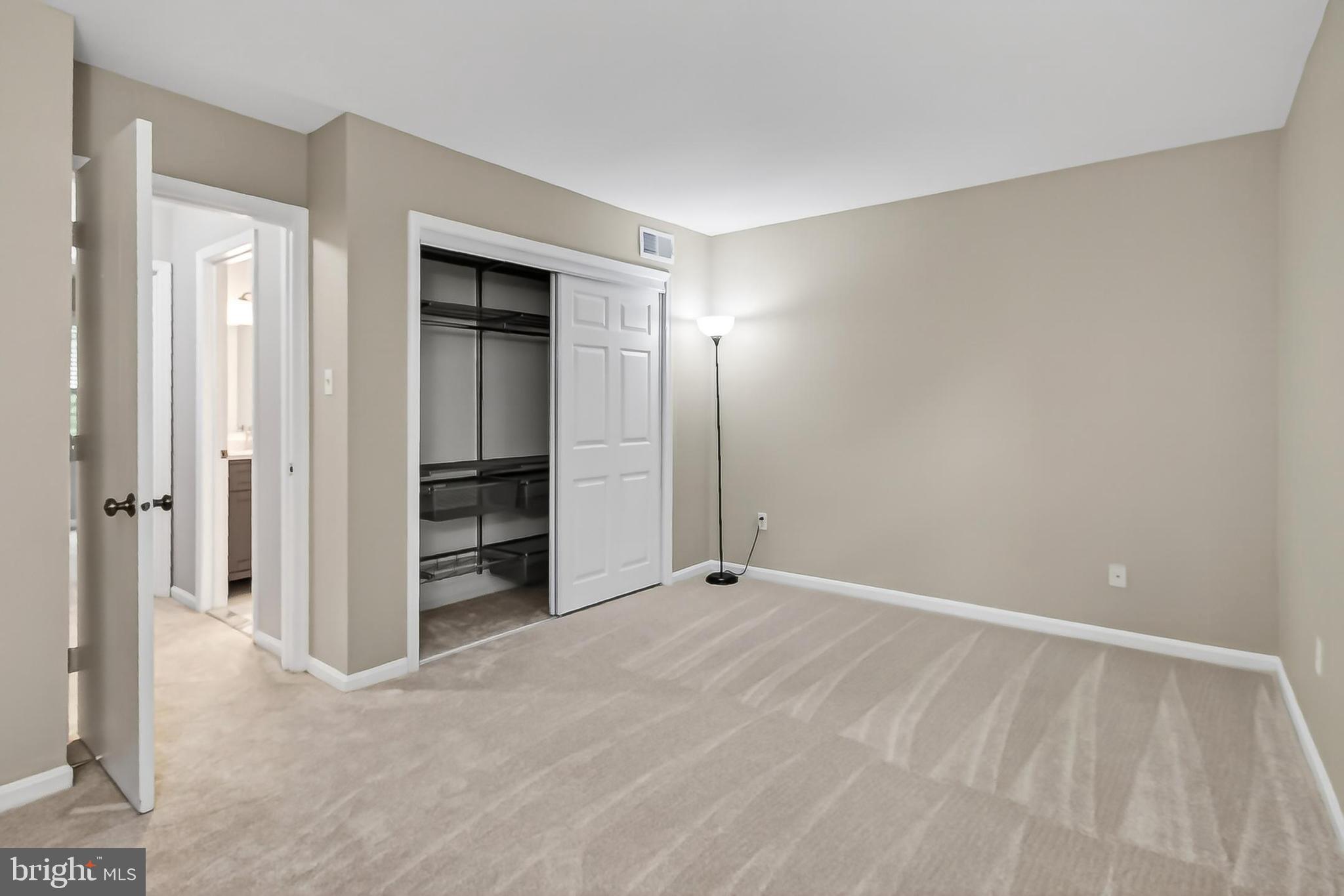 5833 Royal Ridge Drive, Unit 943 Springfield, VA 22152 - Photo 24 of 45 a view of an empty room with closet and a bathroom