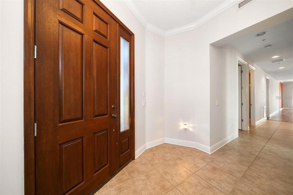1030 Bellasol Way, Unit 201 Apollo Beach, FL 33572 - Photo 2 of 36 a view of a hallway with closet area