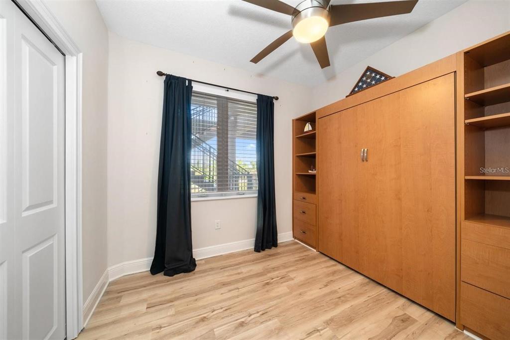 1030 Bellasol Way, Unit 201 Apollo Beach, FL 33572 - Photo 21 of 36 a view of empty room with wooden floor