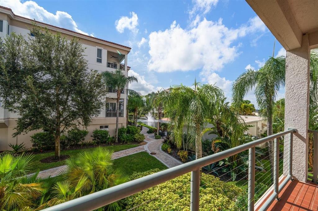 1030 Bellasol Way, Unit 201 Apollo Beach, FL 33572 - Photo 27 of 36 a view of a garden from a balcony