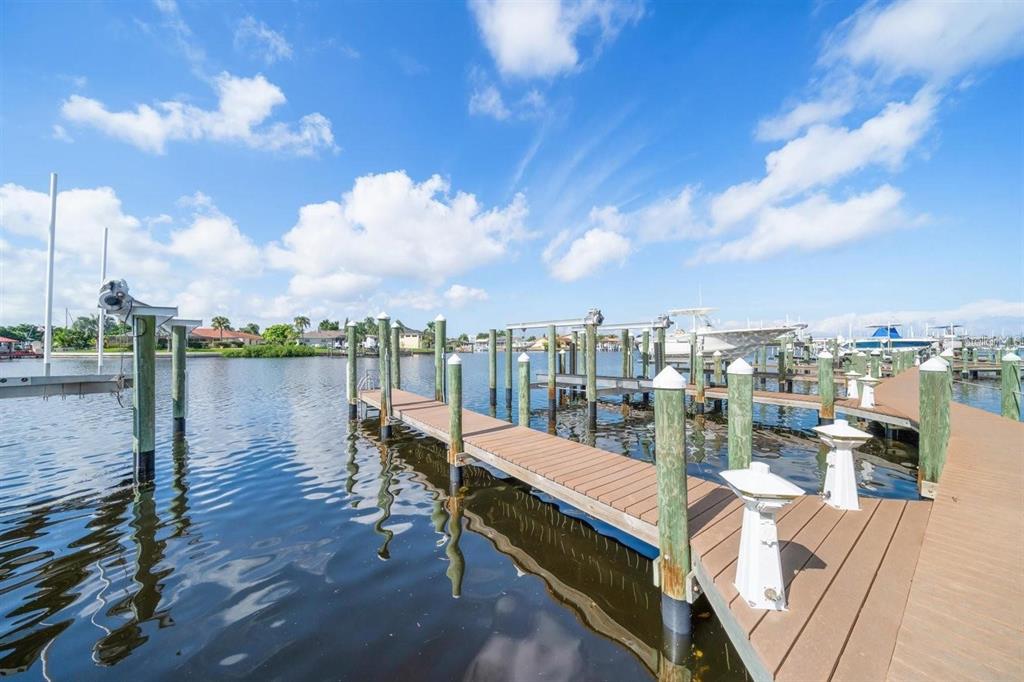 1030 Bellasol Way, Unit 201 Apollo Beach, FL 33572 - Photo 34 of 36 a view of a lake with a terrace