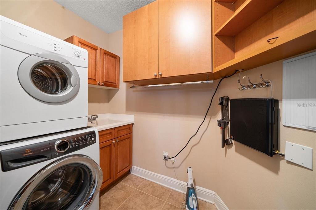 1030 Bellasol Way, Unit 201 Apollo Beach, FL 33572 - Photo 9 of 36 a utility room with dryer and washer