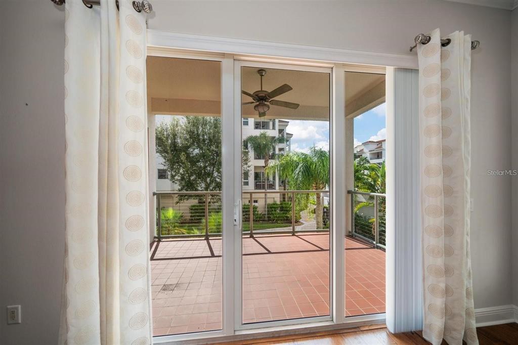 1030 Bellasol Way, Unit 201 Apollo Beach, FL 33572 - Photo 10 of 36 a view of a glass door with a balcony