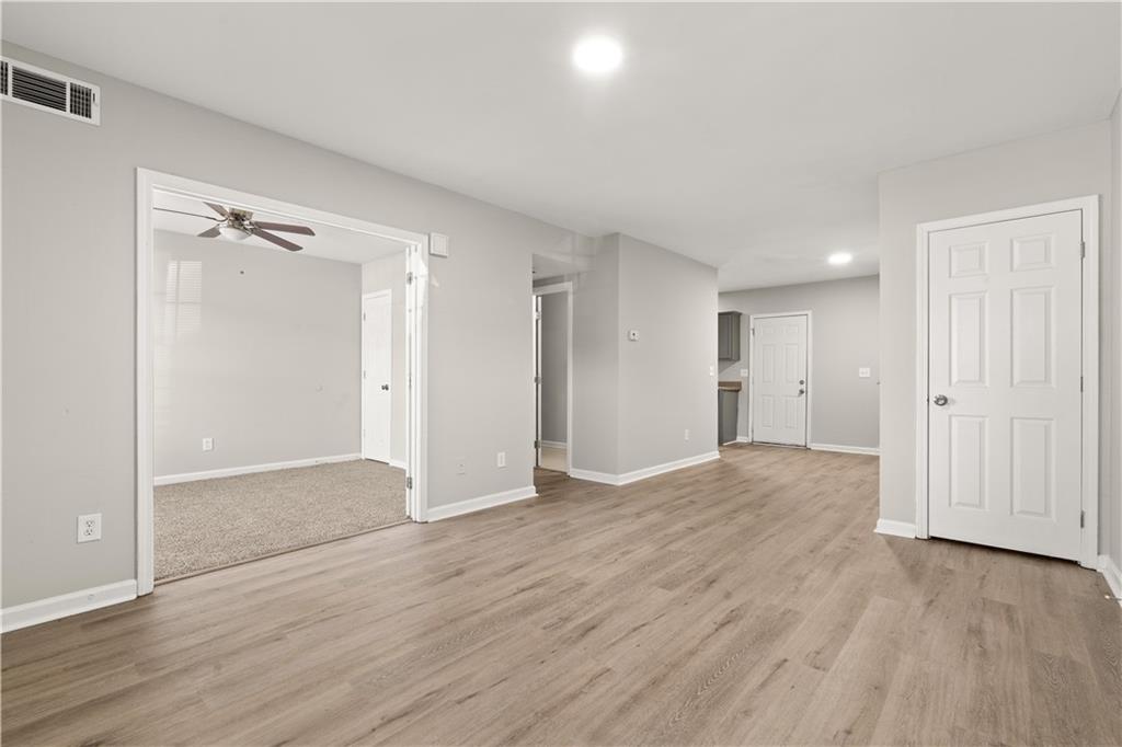1050 Wheel House Lane Monroe, GA 30655 - Photo 3 of 15 wooden floor in an empty room with wooden floor