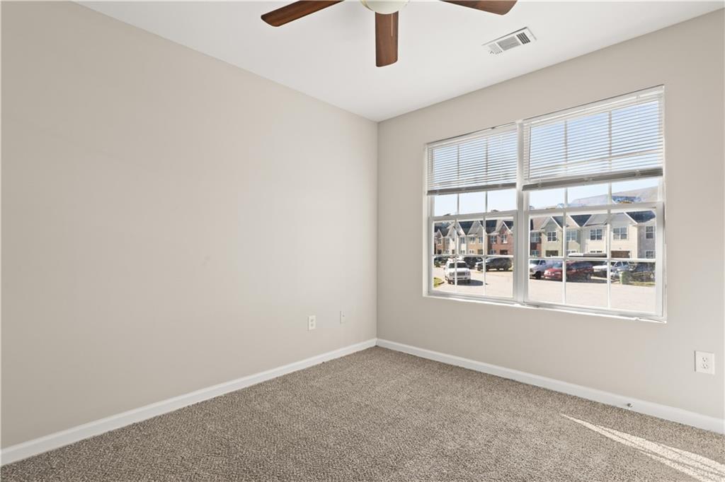 1050 Wheel House Lane Monroe, GA 30655 - Photo 6 of 15 an empty room with a window