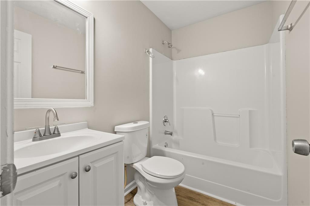 1050 Wheel House Lane Monroe, GA 30655 - Photo 9 of 15 a bathroom with a sink toilet and shower