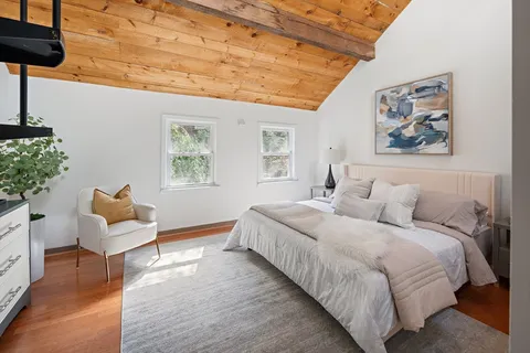 a bedroom with bed and furniture