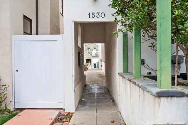 a view of a hallway with wooden walls and stairs