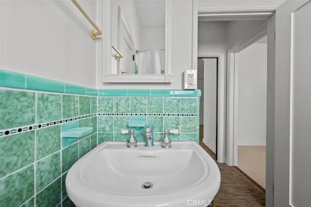 a bathroom with a sink and mirror