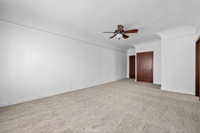 a view of a chandelier fan in a room