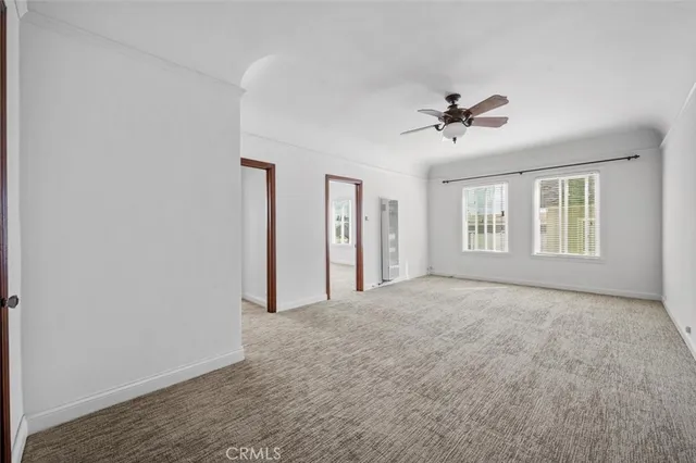 a view of empty room with windows