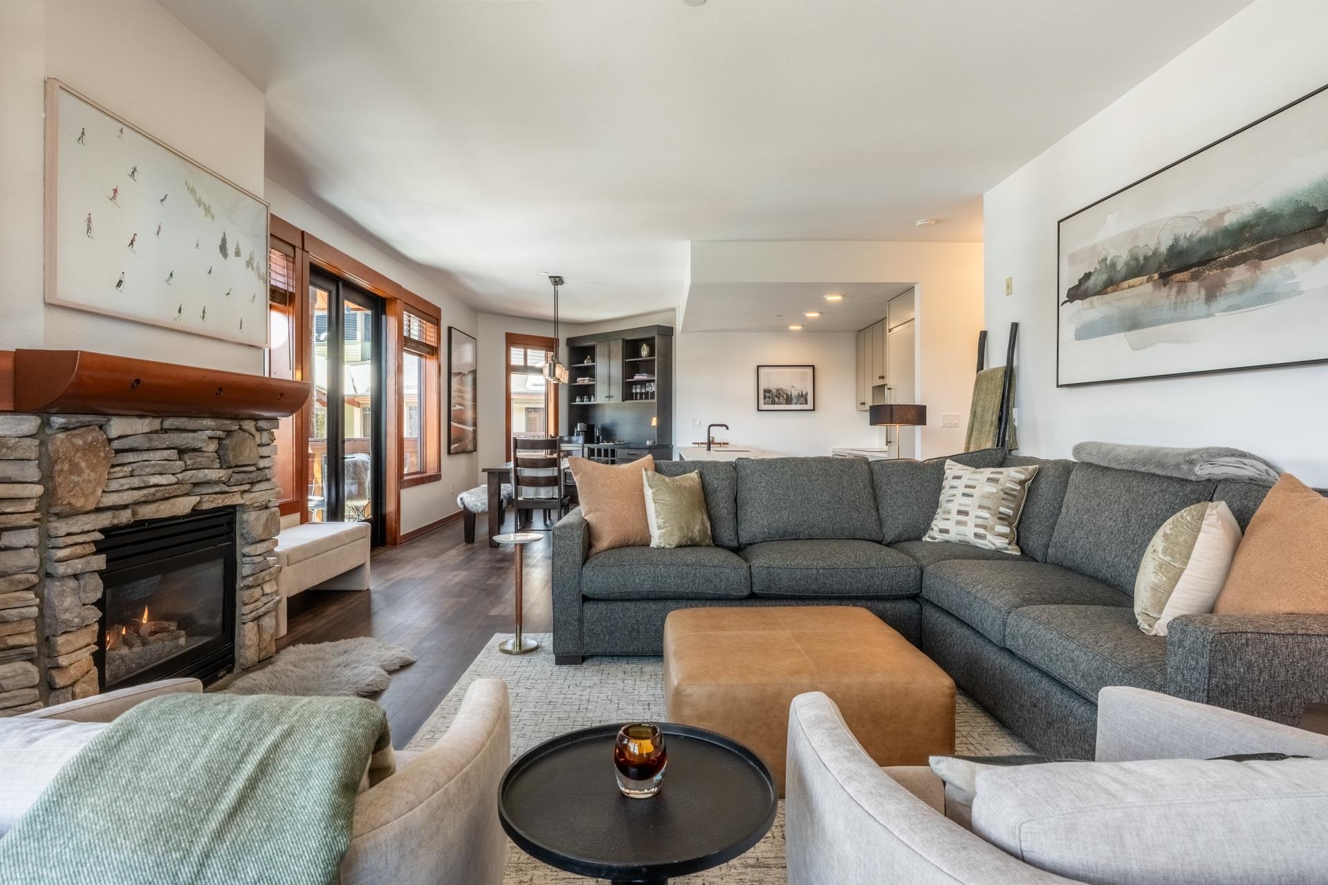 6201 Minaret Road, Unit 2430 Mammoth Lakes, CA 93546 - Photo 2 of 44 Living area featuring a stone fireplace with a wood mantle, large windows, wood-finish flooring, and recessed lighting
