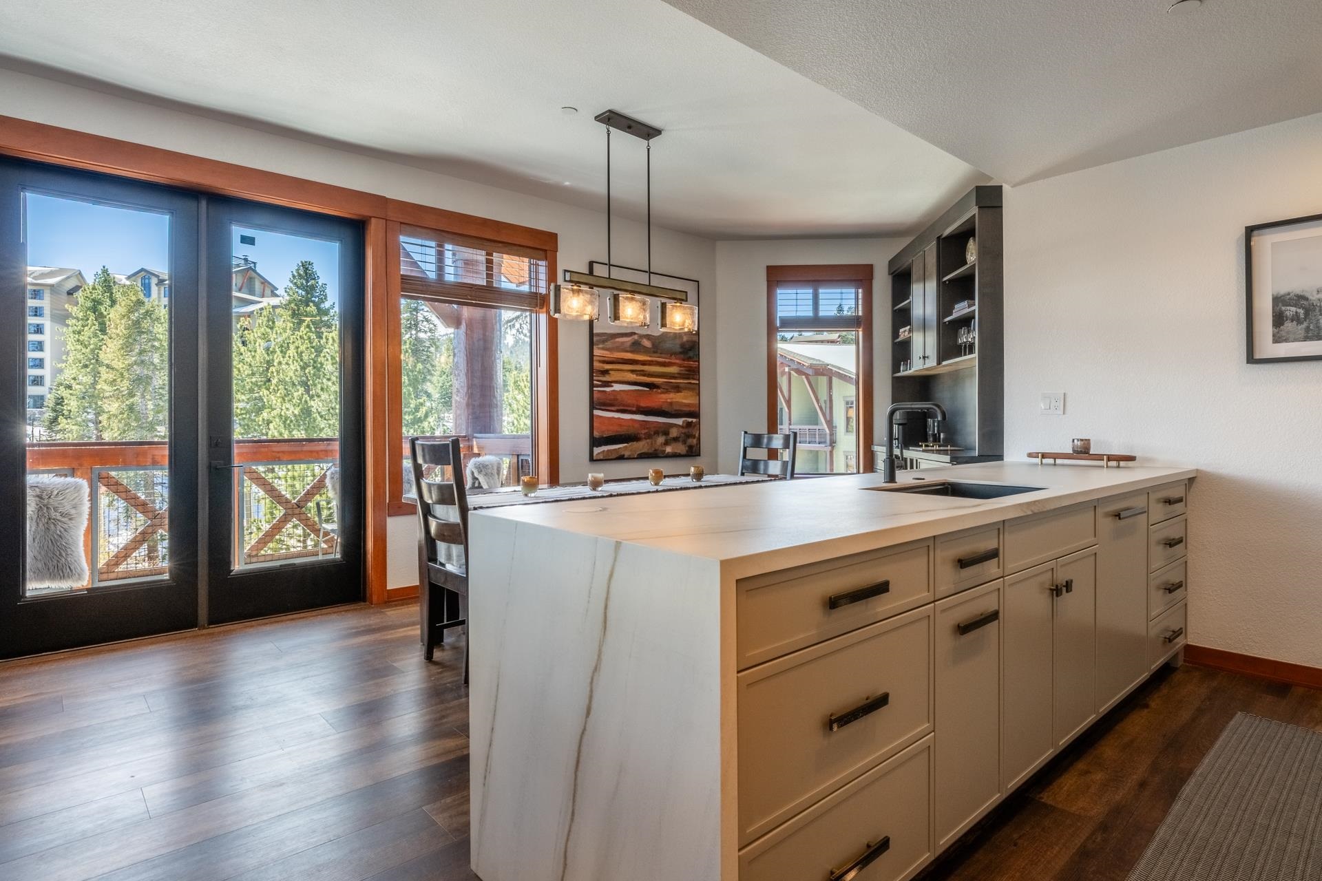 6201 Minaret Road, Unit 2430 Mammoth Lakes, CA 93546 - Photo 3 of 44 Kitchen island with waterfall countertop, integrated sink, and dark bronze faucet