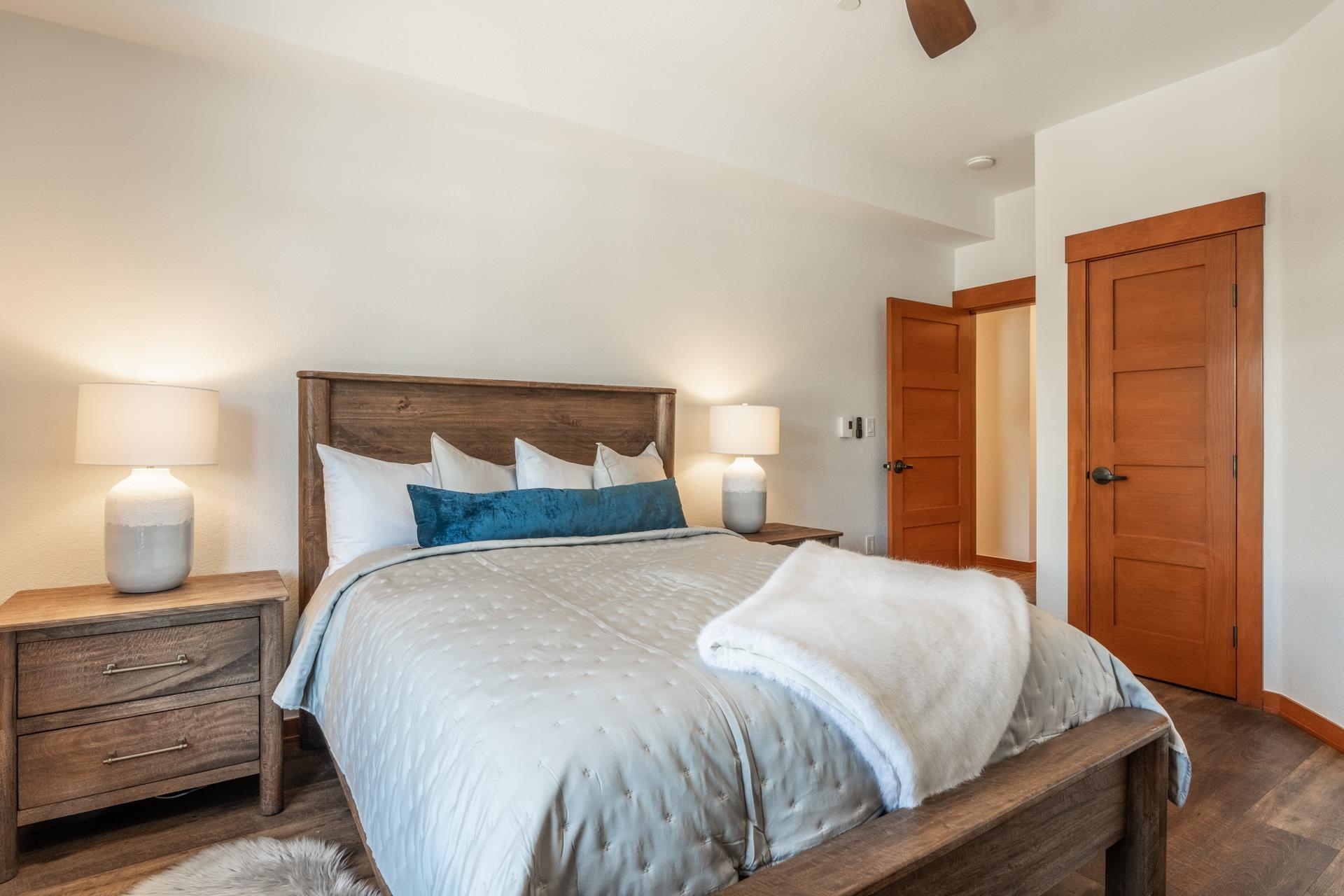 6201 Minaret Road, Unit 2430 Mammoth Lakes, CA 93546 - Photo 25 of 44 Bedroom featuring wood-finish flooring, white walls, and a built-in closet with mirrored sliding doo