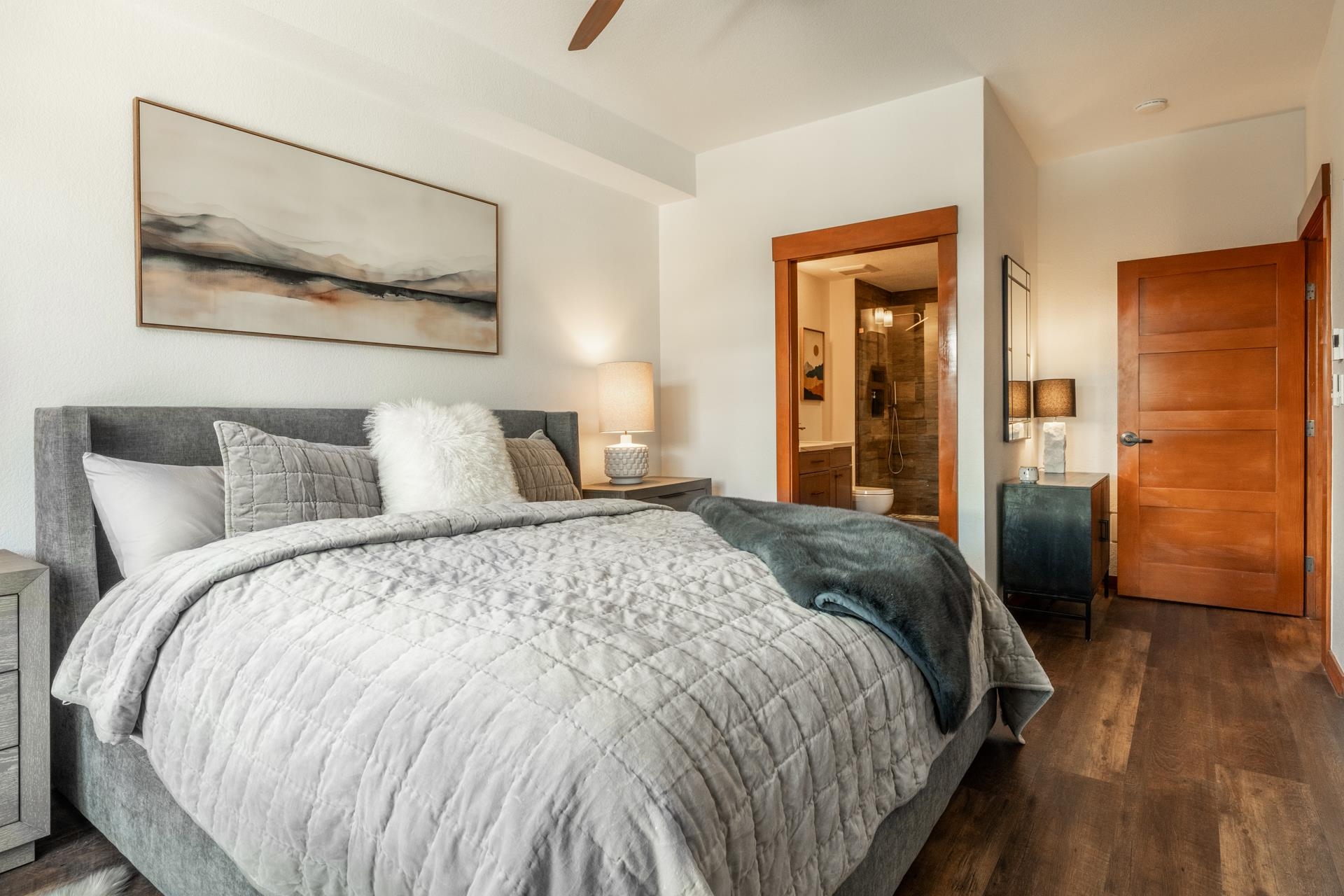 6201 Minaret Road, Unit 2430 Mammoth Lakes, CA 93546 - Photo 5 of 44 Bedroom featuring wood-finish flooring, a ceiling fan, and a wood-paneled door