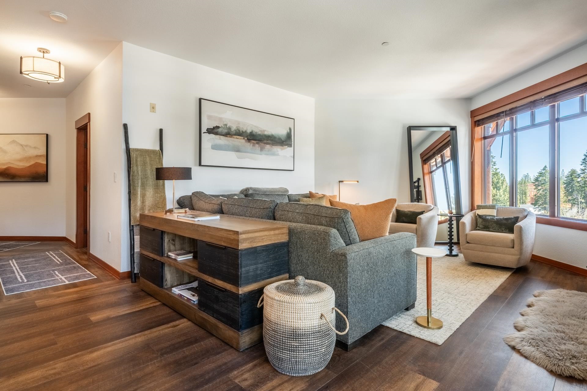 6201 Minaret Road, Unit 2430 Mammoth Lakes, CA 93546 - Photo 10 of 44 Spacious living area featuring wood-finish flooring, a large picture window with wood trim, and recessed lighting