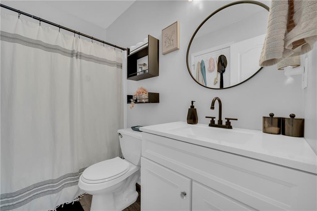 587-j B J B Owens Road Bethlehem, GA 30620 - Photo 58 of 99 a bathroom with a sink a toilet and a mirror