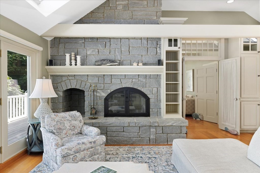 500 Shore Road Chatham, MA 02633 - Photo 13 of 32 a living room with furniture and a fireplace