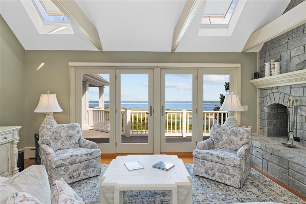 500 Shore Road Chatham, MA 02633 - Photo 14 of 32 a living room with furniture and a fireplace