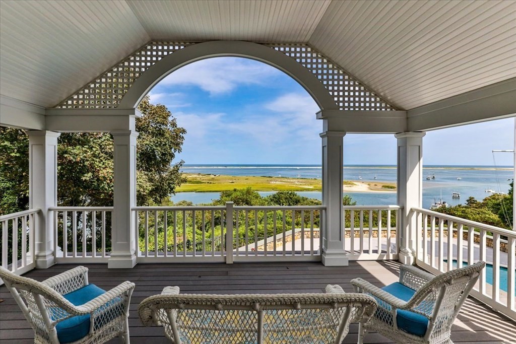 500 Shore Road Chatham, MA 02633 - Photo 15 of 32 a view of a chairs and table in patio with wooden floor